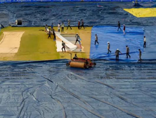 Toss delayed due to wet ground, inspection scheduled for 8:15 am