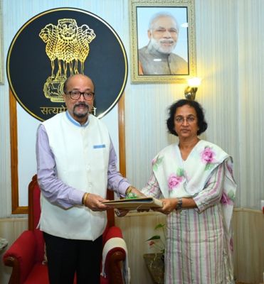 Public Service Commission Chairperson Ms. Shandilya presented the annual report to Governor Deka.